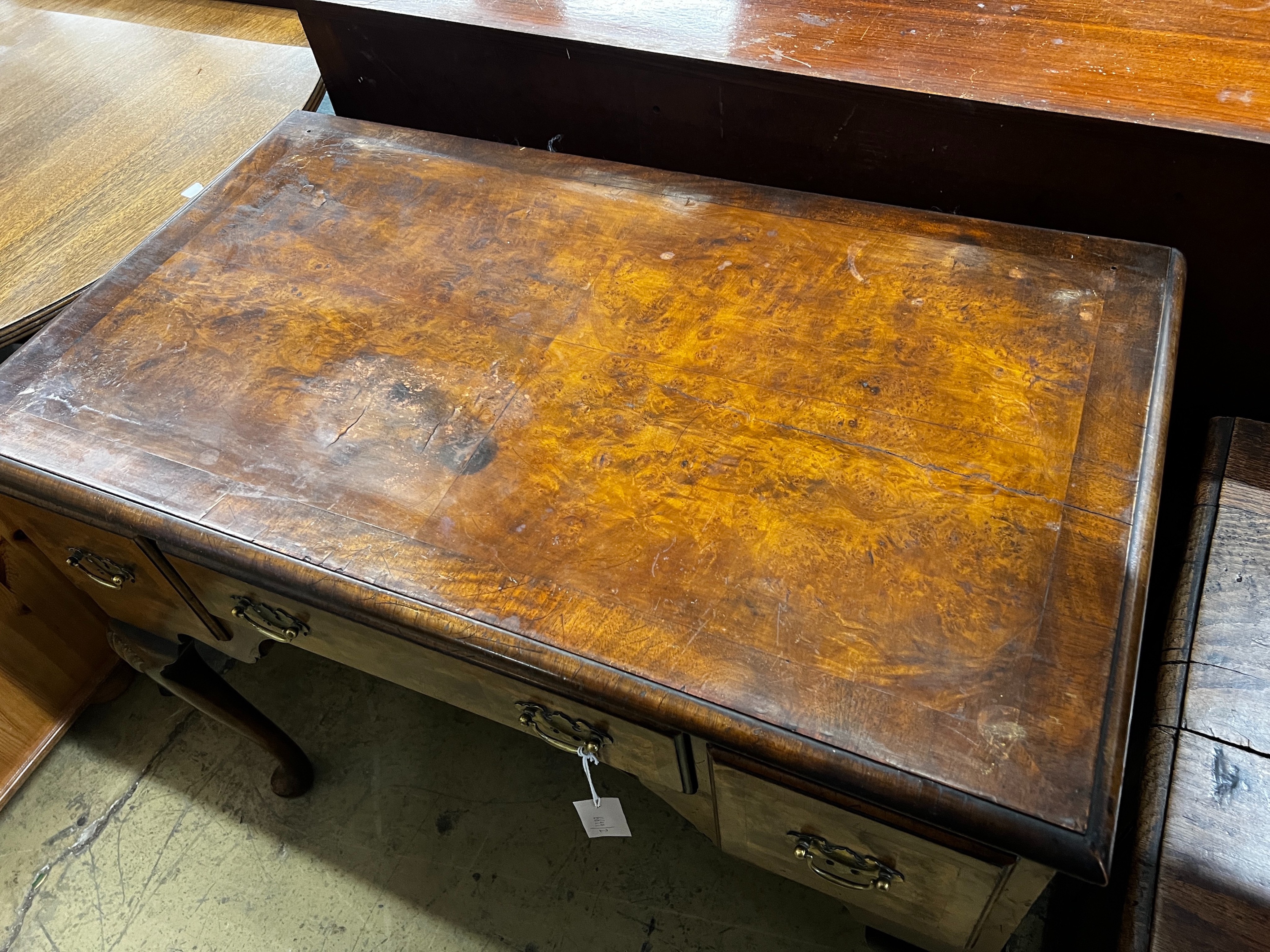 A Queen Anne revival walnut kneehole table, length 92cm, depth 53cm, height 76cm